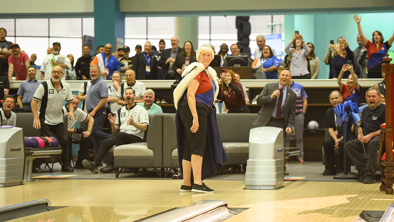 Vicki Larsen and crowd react to the ceremonial first ball of the 2026 USBC Open Championships